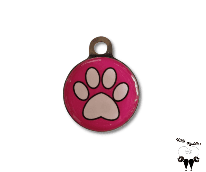 White paw on pink pet ID tag